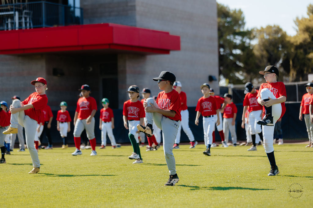 Baseball campers walking with a coach at UNLV