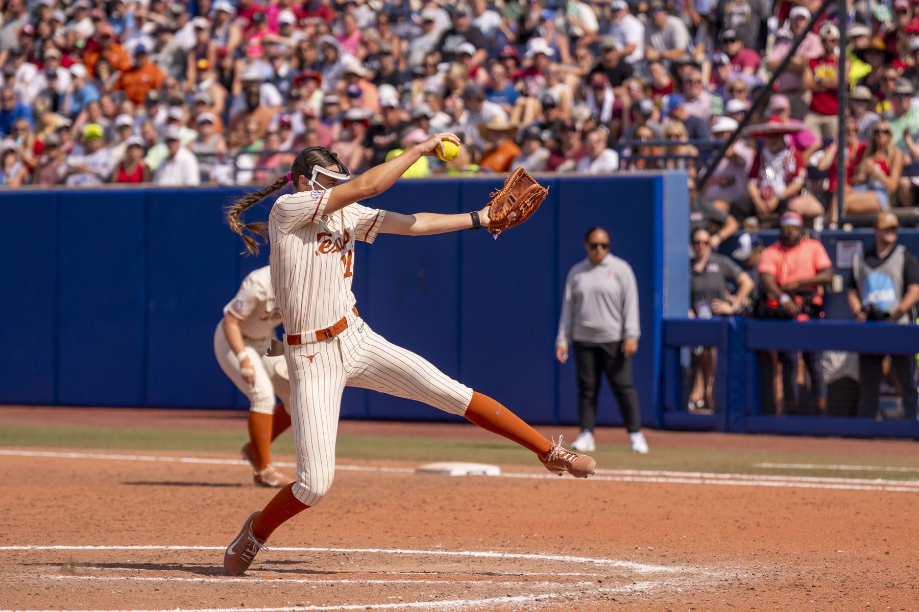Teagan pitching for Texas in pinstripes at the Women's College World Series